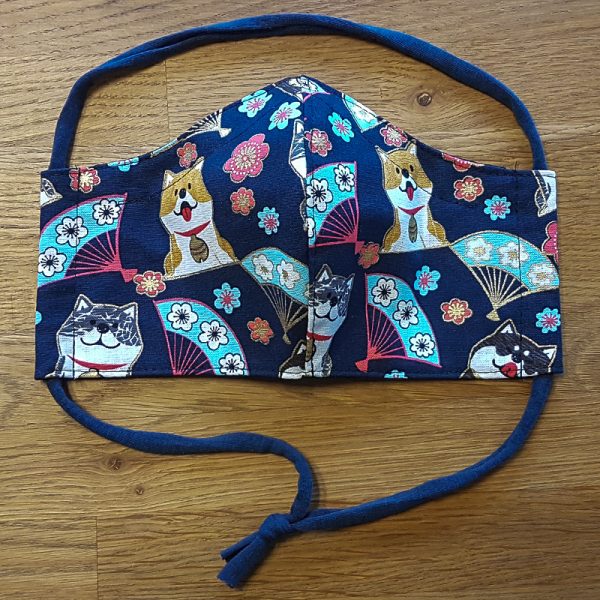 Fabric facemask with cute dogs and fans print on dark blue background
